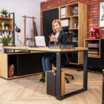 person working at a wood desk