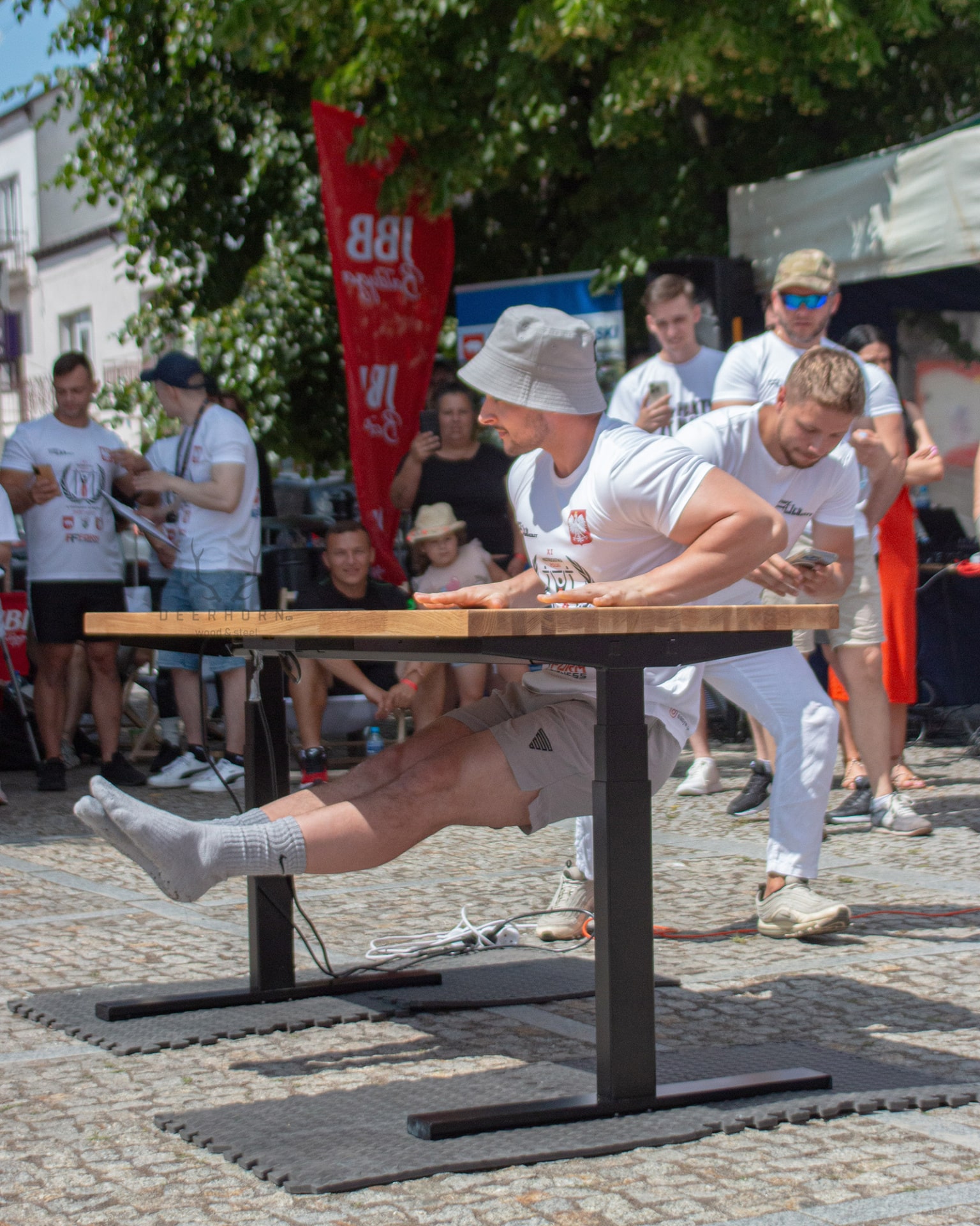 Saibov testing the durability of an electric desk