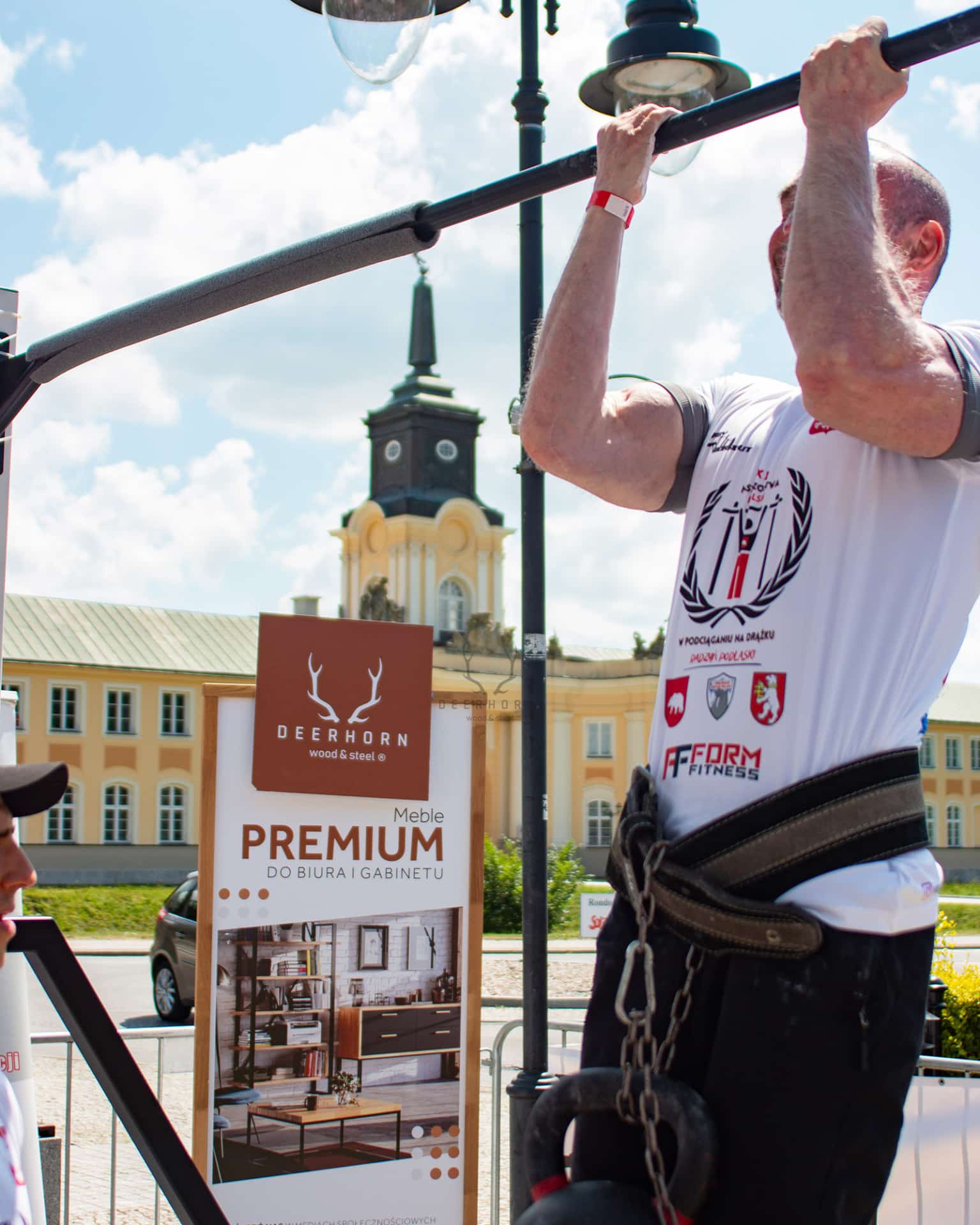 an athlete doing pull-ups on a bar