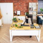L-shaped white desk with wood accessories