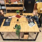 black desks standing side by side
