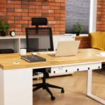 desk with thick wooden top and cable organizer