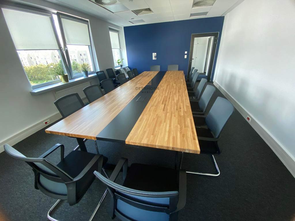long wooden table with black elements