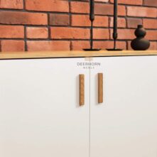 white modern chest of drawers with wooden handles