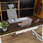 white desk with brown top on white metal legs