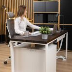 white desk with wooden top and pedestal