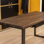 large black desk with black brown top