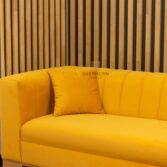 yellow sofa with cushions
