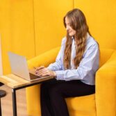 fashionable armchair in intense mustard color