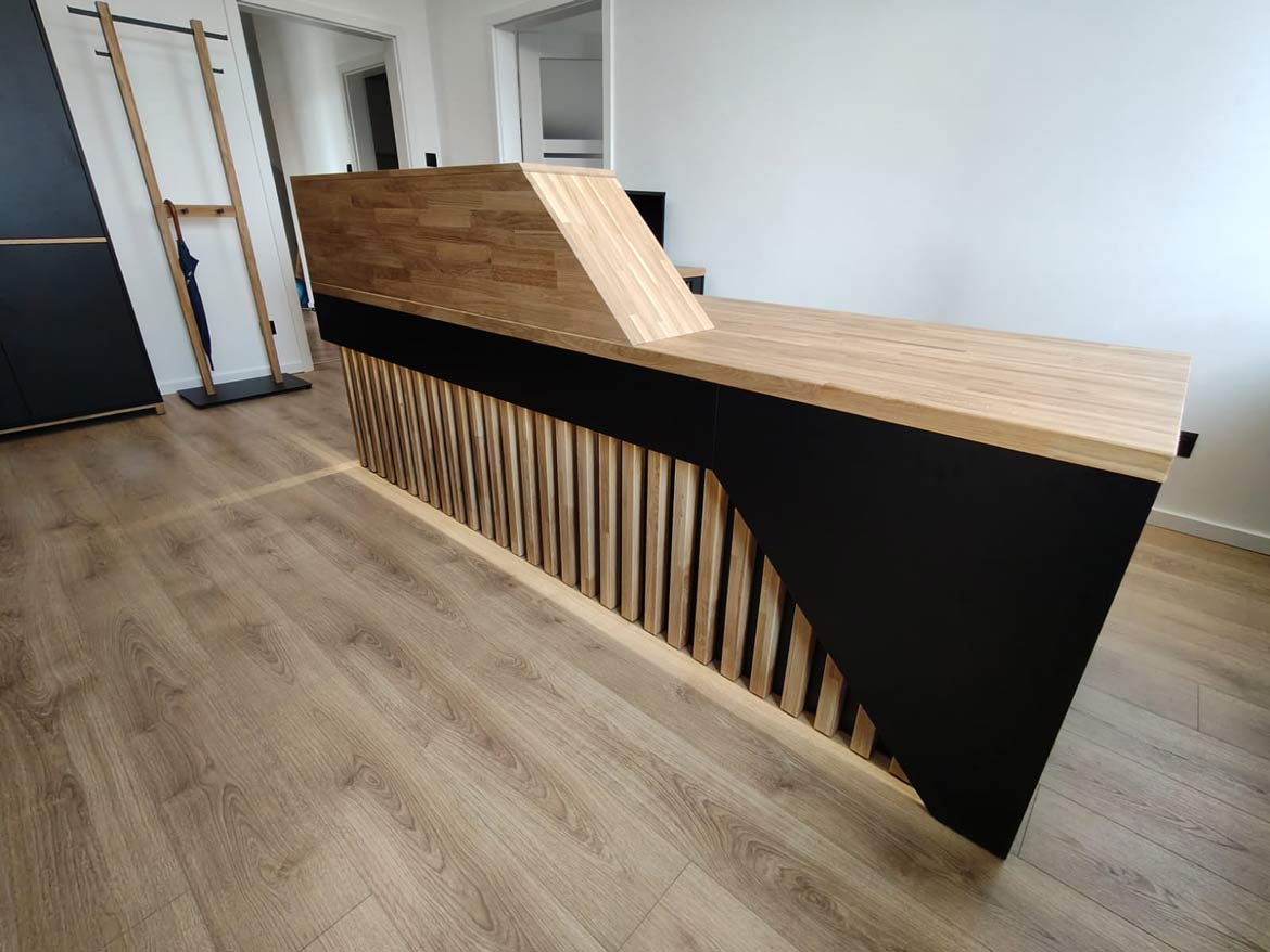Designer reception counter with geometric finish
