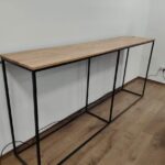Narrow console with wooden top and metal structure in loft style