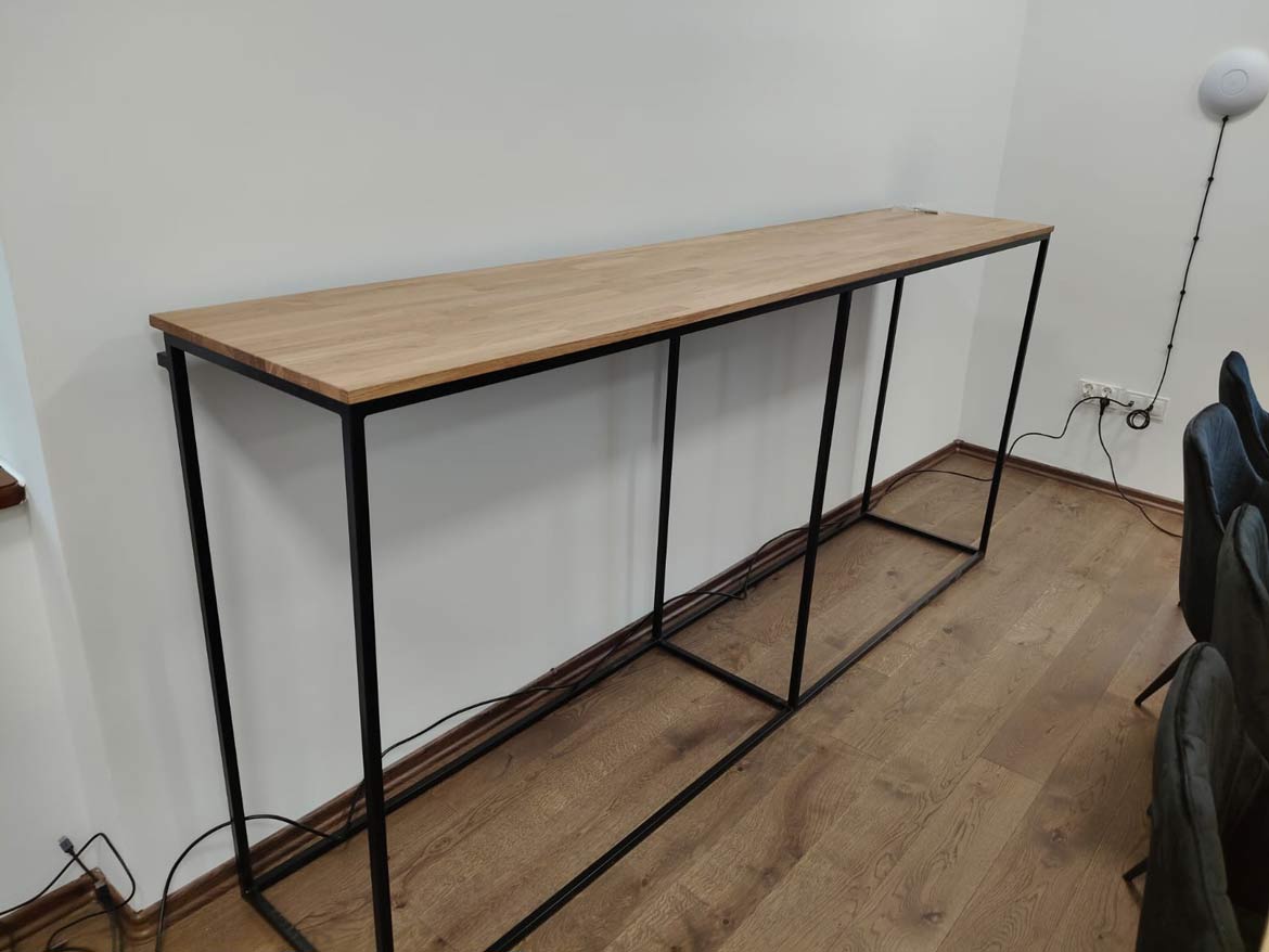 Narrow console with wooden top and metal structure in loft style