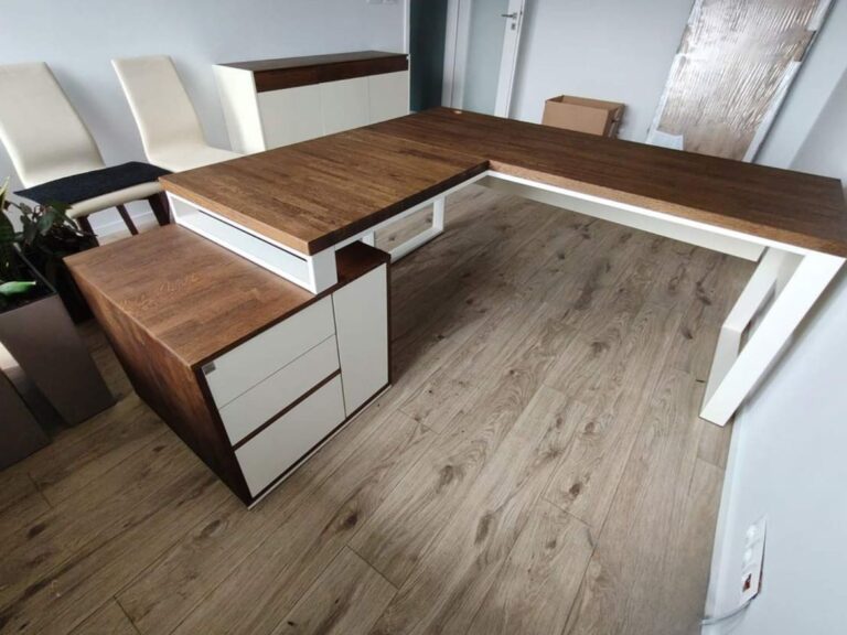 Corner desk in dark wood shade with white accents in a modern interior