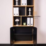 tall bookcase with shelves for books and decorations
