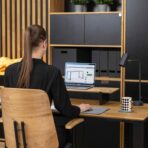 desk with laptop and lamp