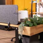 PET desk with a partition between workstations