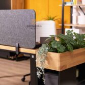 PET desk with a partition between workstations