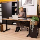 black adjustable desk with swivel chair