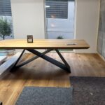 Large table with thick oak top on a metal base