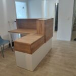 White reception counter for German company Gesundheit Wurmtal Praxis fur Ergotherapie