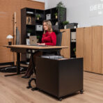 Desk with ergonomic height adjustment and mobile pedestal