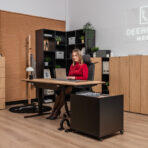 Height adjustable desk with functional side pedestal