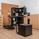 Height-adjustable desk with pedestal for storing accessories