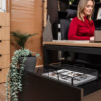 Desk with metal legs and woodgrain top finish