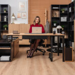 collection of office furniture in the combination of light-colored board and black elements