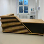 Reception counter for Praxis Schirmer medical office in Cologne