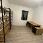 Office with shelving and desk for a client from Germany