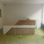 Reception counter with fins for a hearing aid salon in Kirchheimbolanden (Germany)