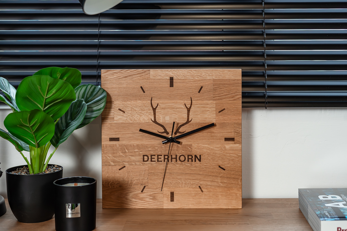 wooden-engraved-clock a clock with an engraving on wood