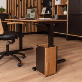 An ergonomic workstation with an electric desk that allows you to work while sitting or standing