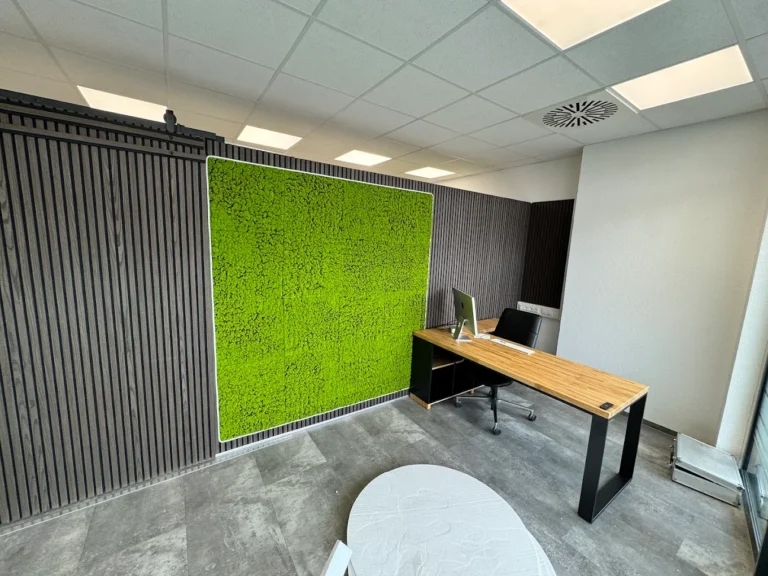 Modern Office corner desk by a green moss wall for ZERO driving school from Friedrichshafen (Germany)