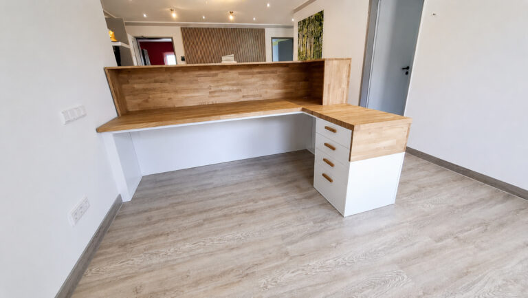 White reception desk for a dental office in Germany