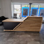 Reception desk with slats for the Allianz insurance agency in Rehau, Germany