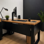 A corner desk in a small room