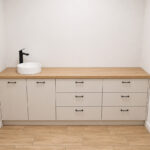 Large, custom-made wall-to-wall vanity cabinet