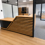 Reception desk with oak slats