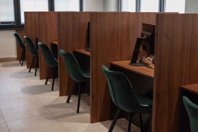 Desks with partitions for customer service at a government office