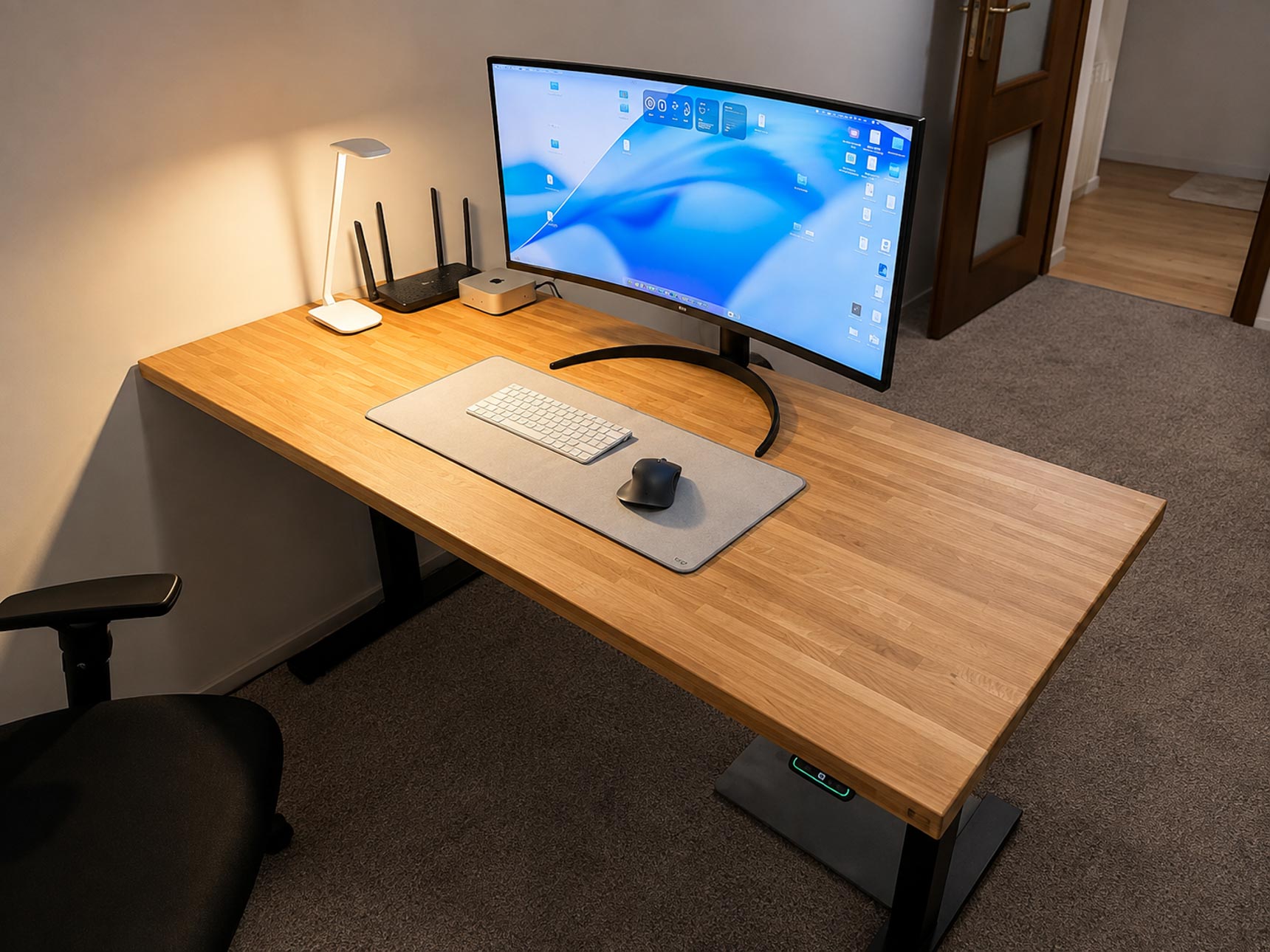 Adjustable desk with a wooden tabletop for the home office