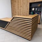 Corner reception desk with wooden slats