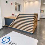 A custom-made navy blue reception desk for the company's headquarters