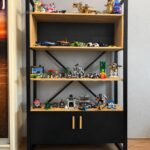 Oak bookcase with a black cabinet and doors