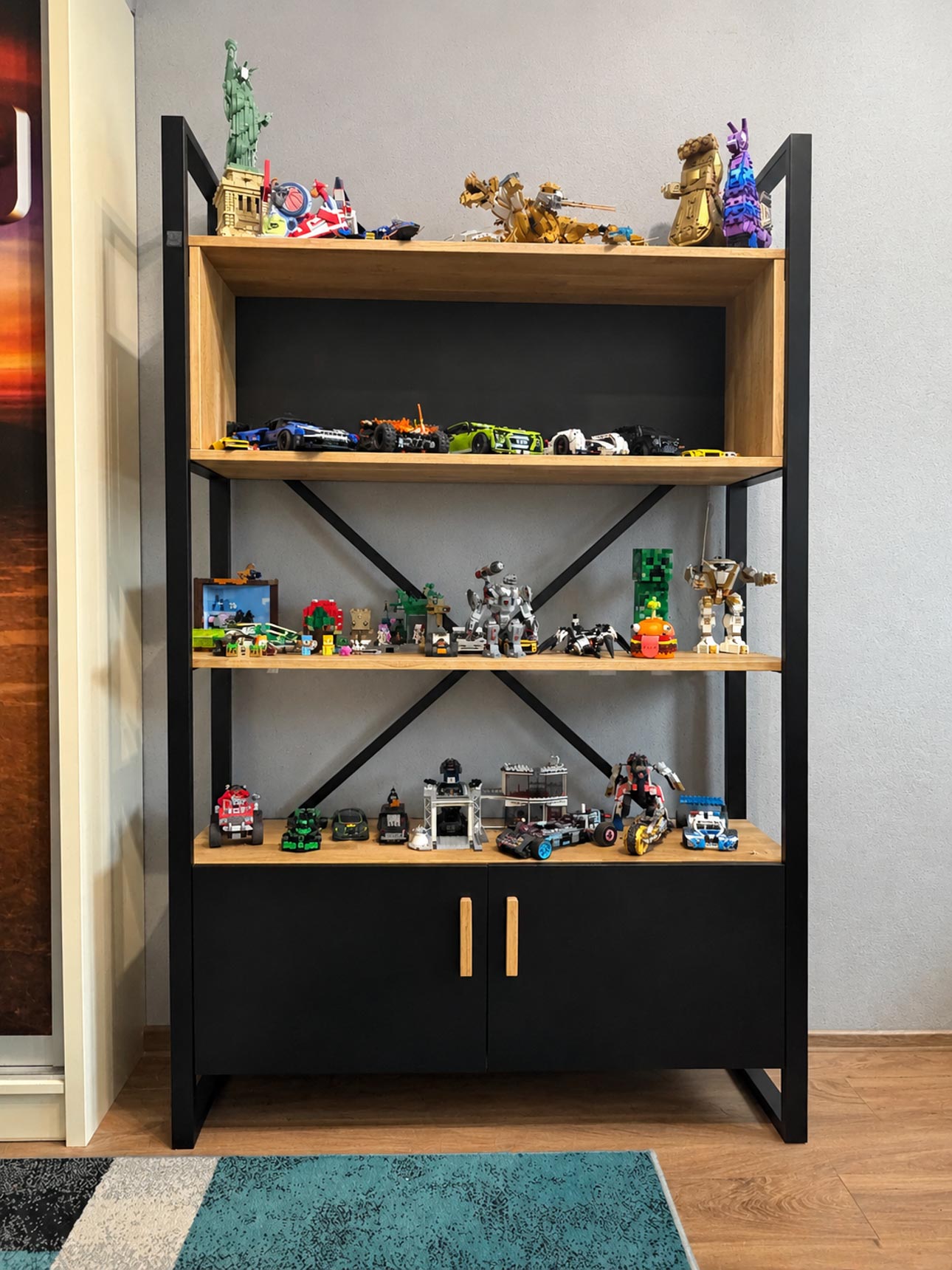 Oak bookshelf with a black cabinet and doors