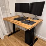 Home office computer workstation with a height-adjustable desk