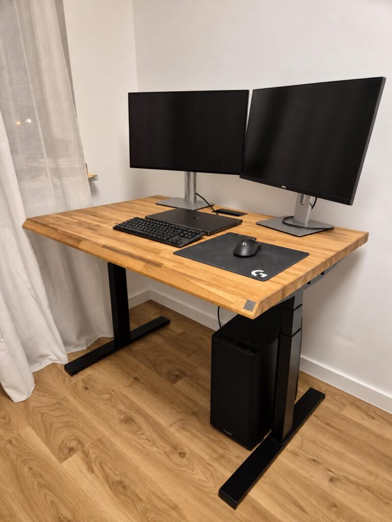 Home office computer workstation with a height-adjustable desk