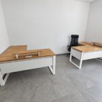 White office furniture with an oak countertop and a cabinet with oak handles