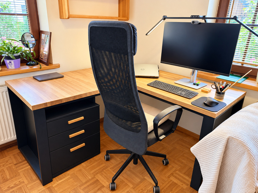 Wooden corner desk with a black frame and a storage unit for a real estate office